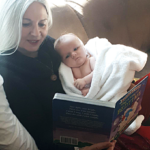 Susan Terry reading to baby
