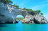 Rock archway over water